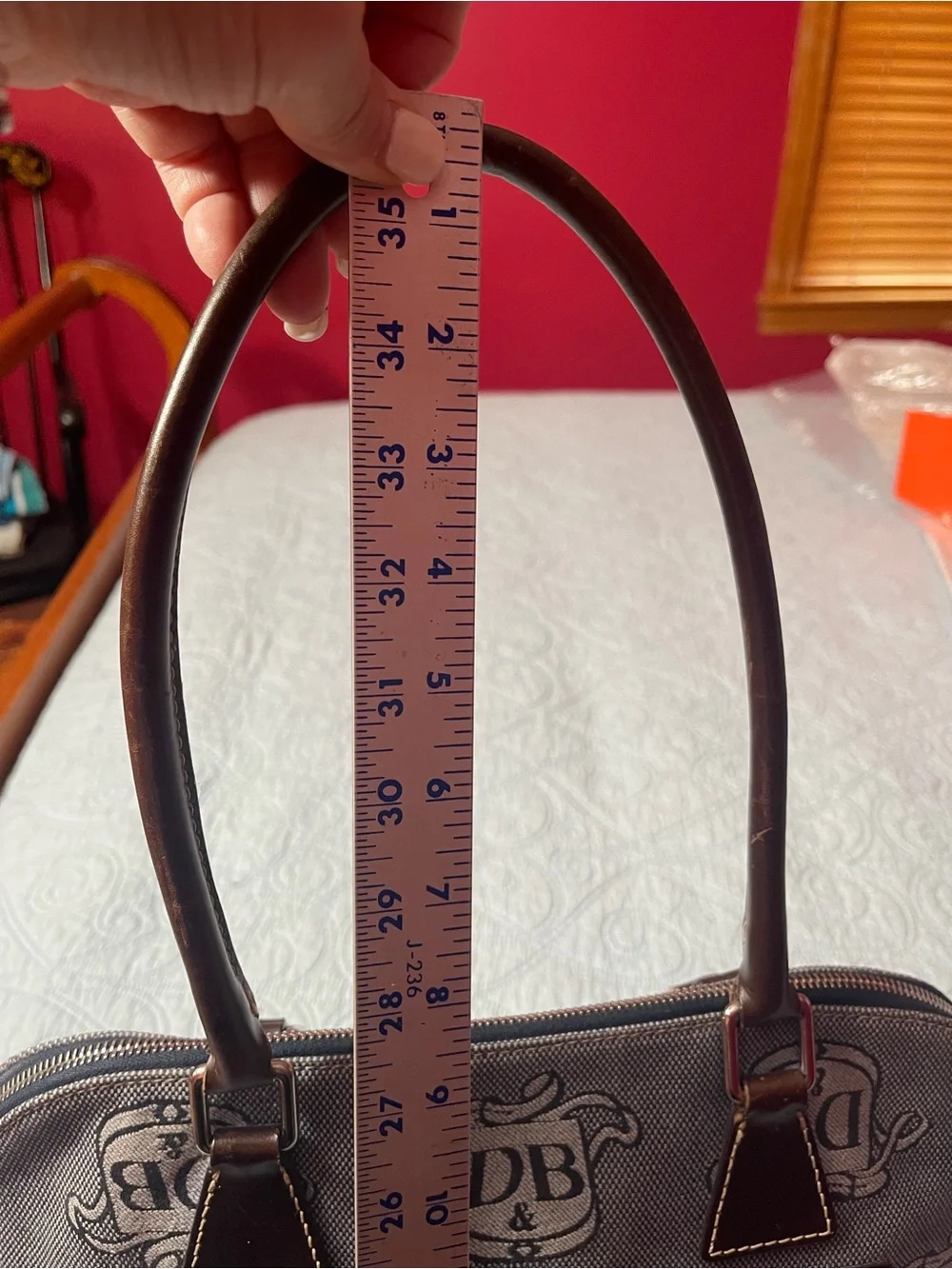 Dooney and Bourke Monogram Denim Donegal Dome Satchel with brown leather trim.